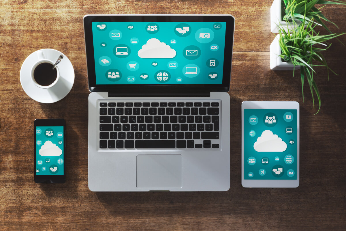 Laptop, phone and tablet on office desk